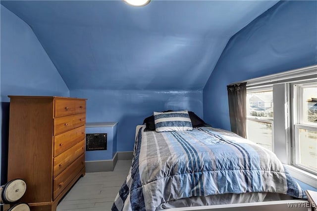 bedroom featuring lofted ceiling