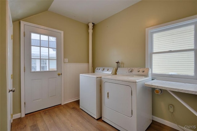 88 Walton St, Alexandria, NY 13607 - clothes washing area featuring a wainscoted wall, laundry area, light wood-style floors, and washer and dryer