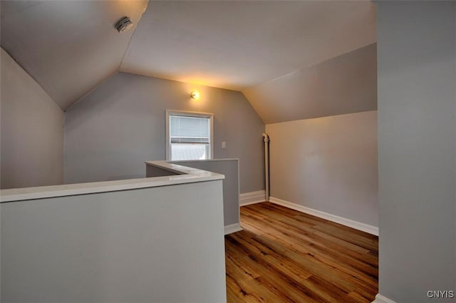88 Walton St, Alexandria, NY 13607 - bonus room featuring baseboards, lofted ceiling, and wood finished floors