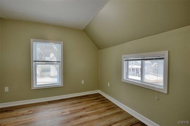 88 Walton St, Alexandria, NY 13607 - additional living space with light wood-style flooring, baseboards, and vaulted ceiling