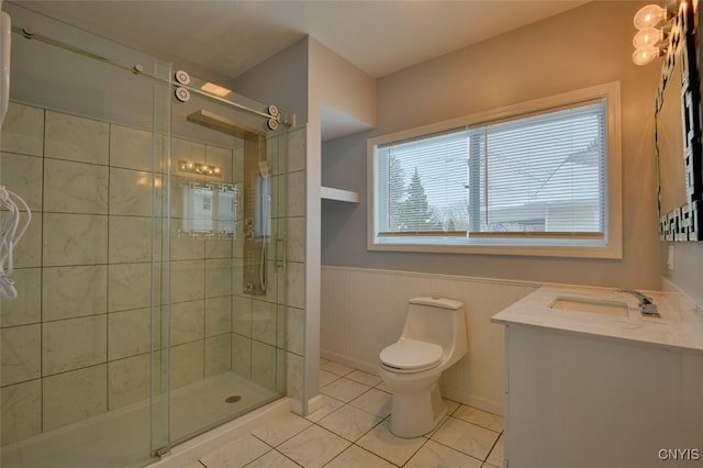 88 Walton St, Alexandria, NY 13607 - full bathroom with toilet, vanity, a stall shower, tile patterned flooring, and wainscoting