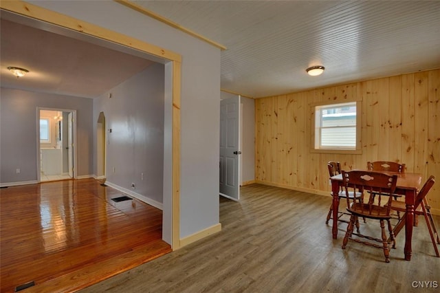 88 Walton St, Alexandria, NY 13607 - dining room with baseboards, arched walkways, visible vents, and wood finished floors