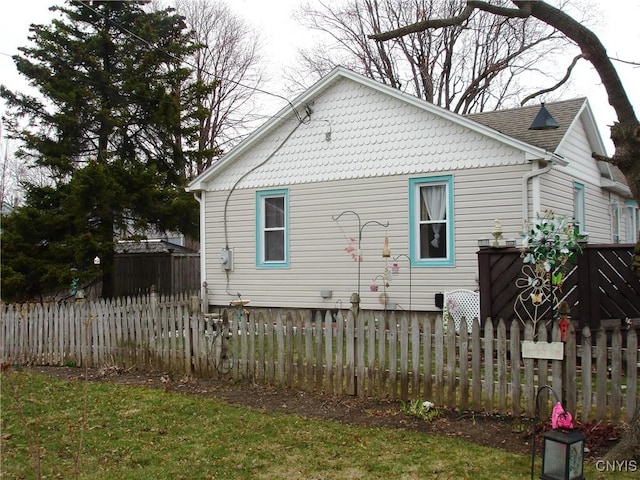 view of home's exterior featuring fence private yard