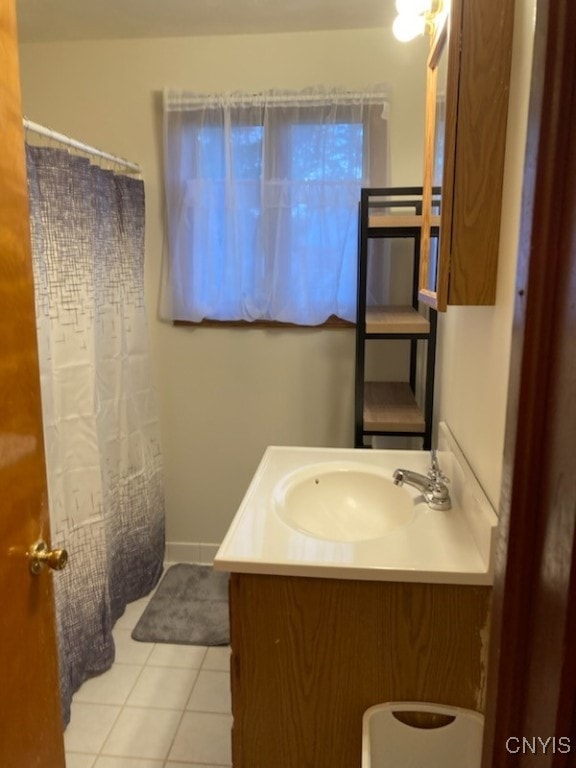 bathroom featuring a shower with shower curtain, tile patterned flooring, and vanity