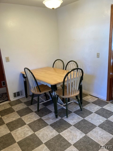 dining room featuring visible vents