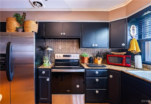 208 Eatonville Rd, Little Falls, NY 13365 - kitchen featuring stainless steel appliances, tasteful backsplash, and crown molding
