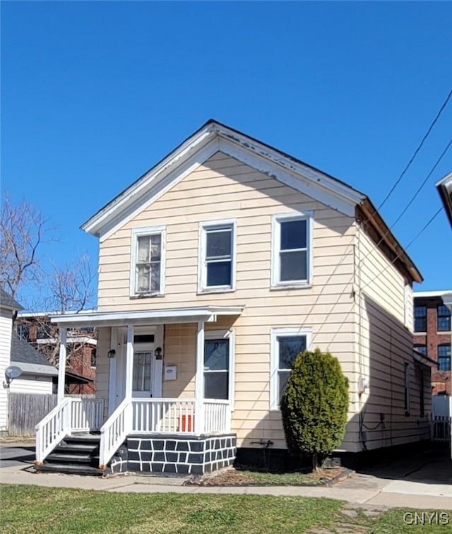 715 Catherine St, Utica, NY 13501 - view of front of home featuring a front yard and covered porch