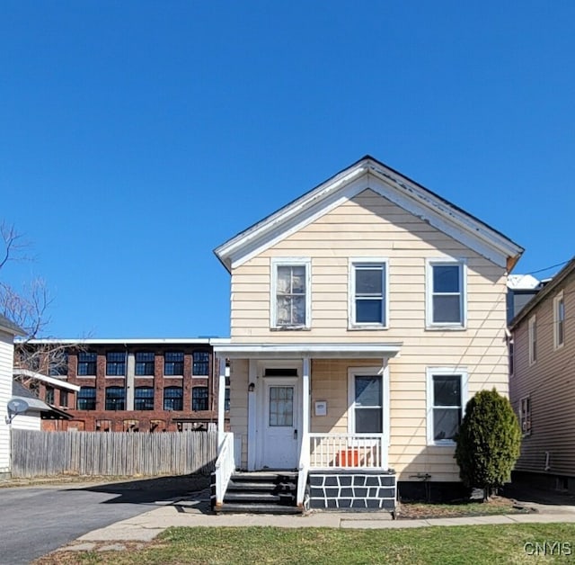 715 Catherine St, Utica, NY 13501 - view of front of house with a porch and fence