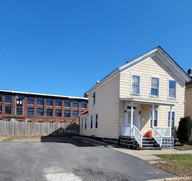 715 Catherine St, Utica, NY 13501 - view of front of home with covered porch and fence