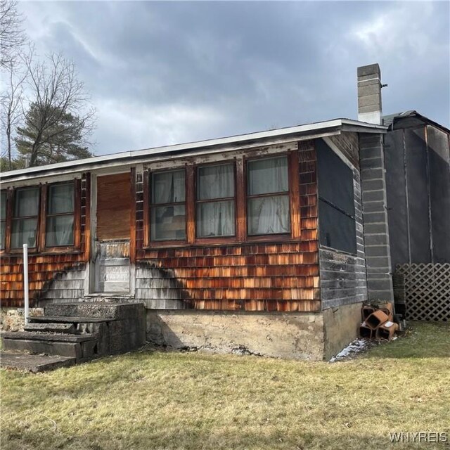 6235 SW Shr, Canadice, NY 14471 - view of side of property with a yard and a chimney