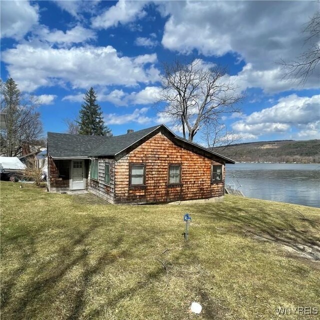 6235 SW Shr, Canadice, NY 14471 - back of property with a water view and a lawn