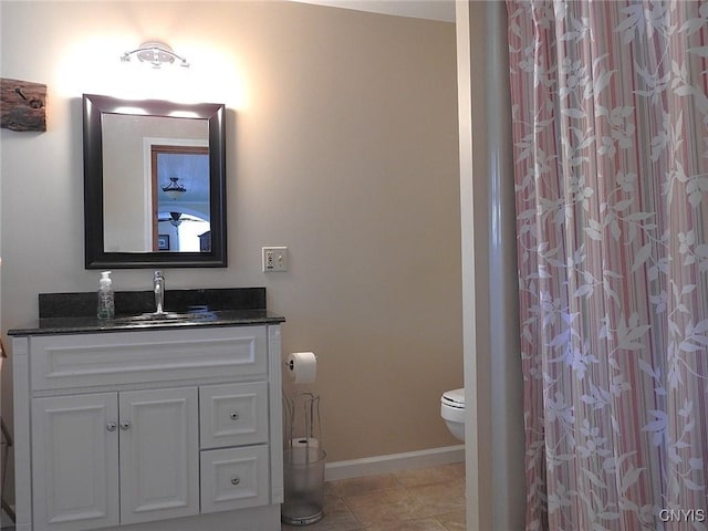 full bath with toilet, curtained shower, vanity, tile patterned flooring, and baseboards