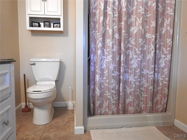 full bathroom featuring tile patterned floors, toilet, baseboards, and curtained shower