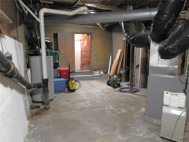 unfinished basement with heating unit and gas water heater