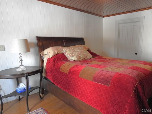 bedroom with wood finished floors