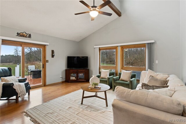 6741 Cole Rd, Orchard Park, NY 14127 - living area featuring light wood-type flooring, high vaulted ceiling, baseboards, and ceiling fan