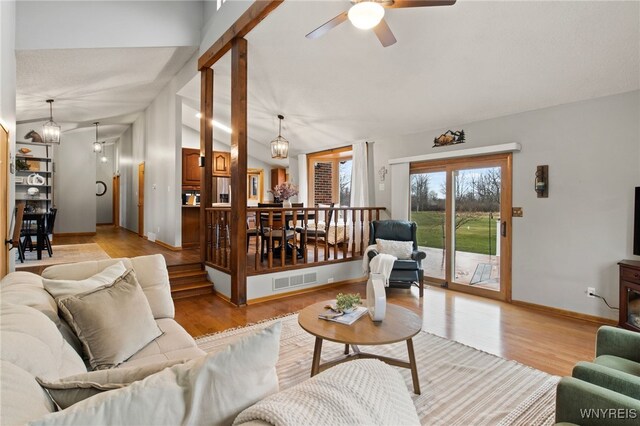 6741 Cole Rd, Orchard Park, NY 14127 - living area with light wood-type flooring, visible vents, lofted ceiling, and ceiling fan