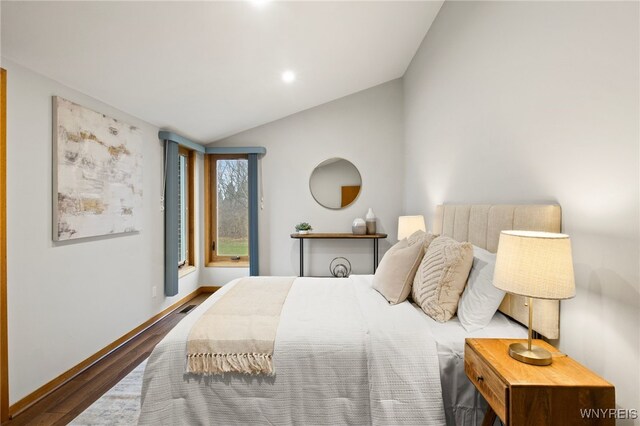 6741 Cole Rd, Orchard Park, NY 14127 - bedroom with vaulted ceiling, recessed lighting, baseboards, visible vents, and wood finished floors