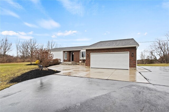 6741 Cole Rd, Orchard Park, NY 14127 - ranch-style house featuring brick siding, a garage, concrete driveway, and roof with shingles