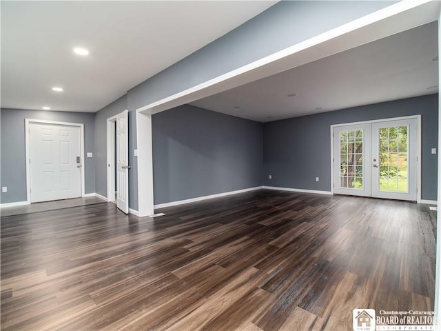 673 Ivory Rd, Carroll, NY 14738 - unfurnished living room with dark wood finished floors, baseboards, recessed lighting, and french doors