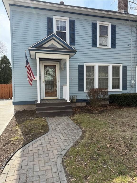 507 W Hudson St, Elmira-City, NY 14904 - view of front of home featuring a chimney and fence