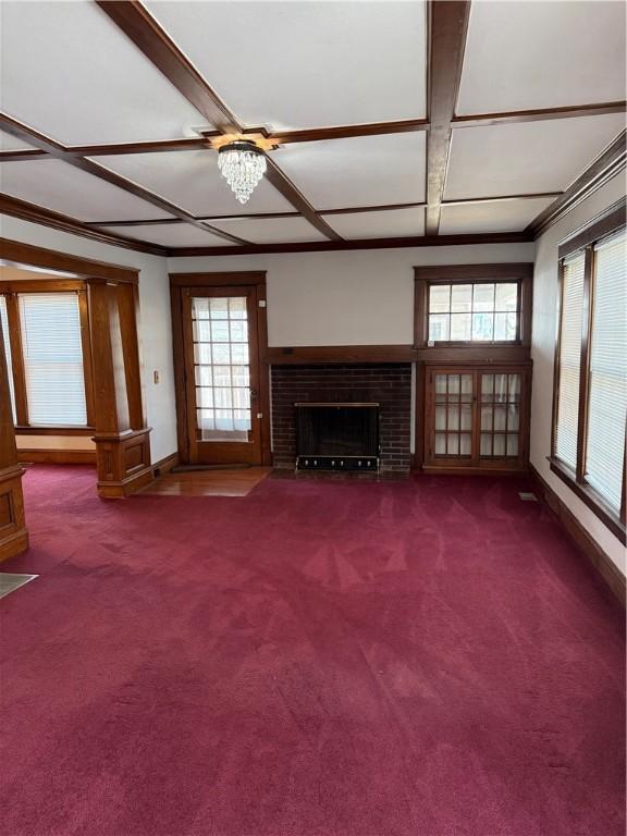 507 W Hudson St, Elmira-City, NY 14904 - unfurnished living room featuring baseboards, carpet, and a brick fireplace