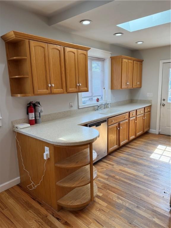 507 W Hudson St, Elmira-City, NY 14904 - kitchen with wood finished floors, a skylight, dishwasher, and open shelves
