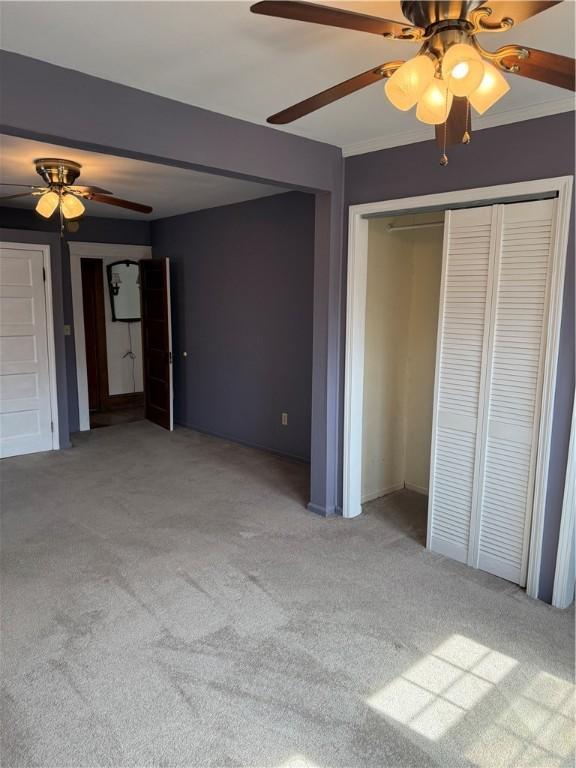 507 W Hudson St, Elmira-City, NY 14904 - unfurnished bedroom with a ceiling fan, carpet, and a closet
