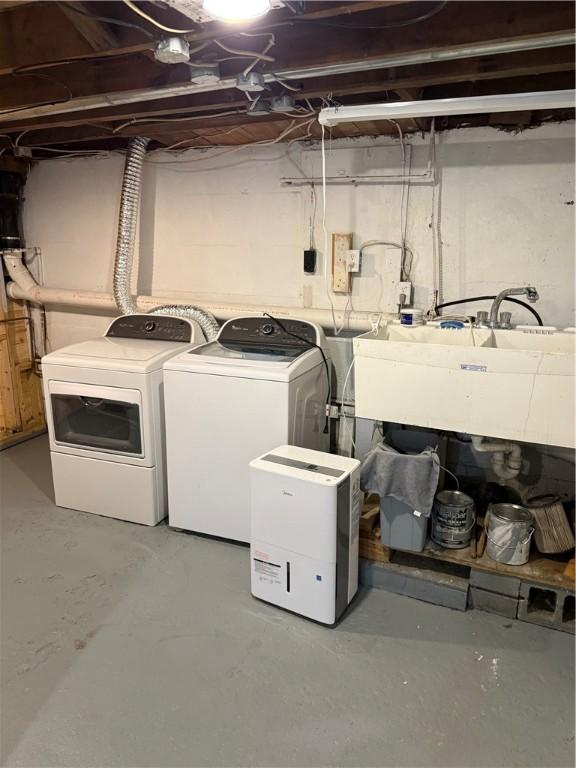 507 W Hudson St, Elmira-City, NY 14904 - washroom featuring washing machine and clothes dryer, a sink, and laundry area