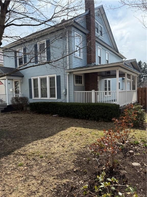 507 W Hudson St, Elmira-City, NY 14904 - rear view of property featuring a chimney and covered porch