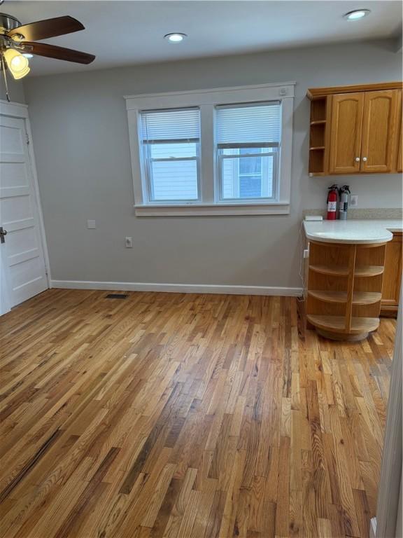 507 W Hudson St, Elmira-City, NY 14904 - interior space with baseboards, light wood-style floors, and a ceiling fan