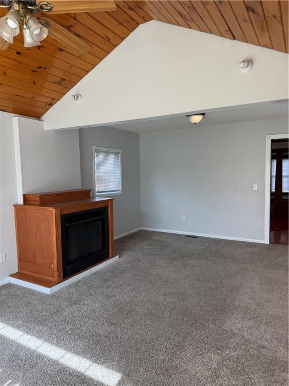 507 W Hudson St, Elmira-City, NY 14904 - unfurnished living room with high vaulted ceiling, carpet, baseboards, a ceiling fan, and wooden ceiling