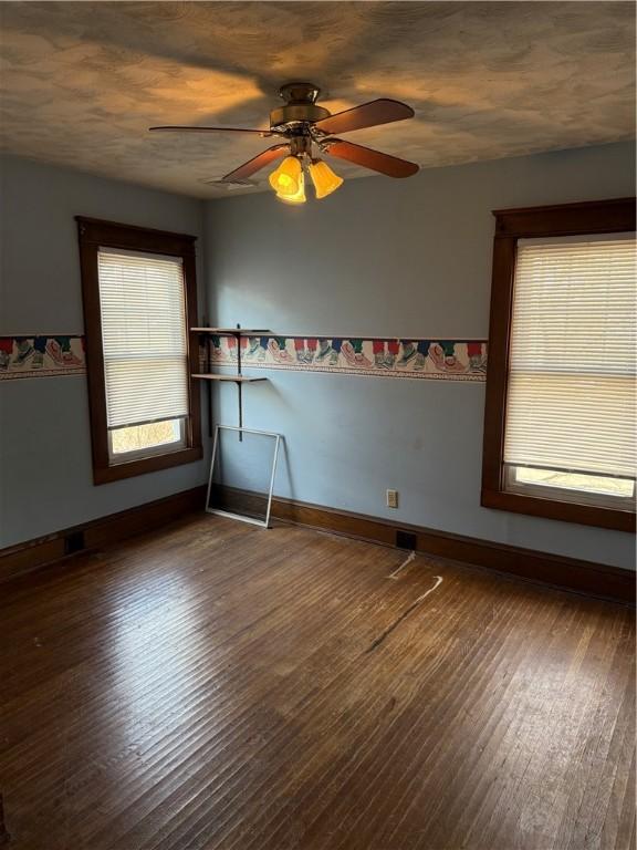 507 W Hudson St, Elmira-City, NY 14904 - unfurnished room with a ceiling fan, baseboards, and wood finished floors