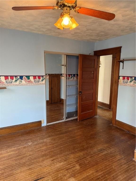 507 W Hudson St, Elmira-City, NY 14904 - unfurnished room with a textured ceiling, baseboards, wood finished floors, and a ceiling fan