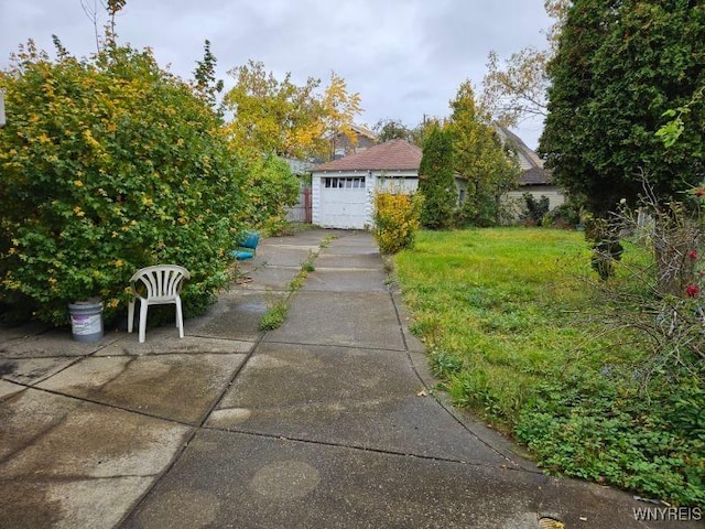 49 Newburgh Ave, Buffalo, NY 14211 - view of grassy yard with a detached garage