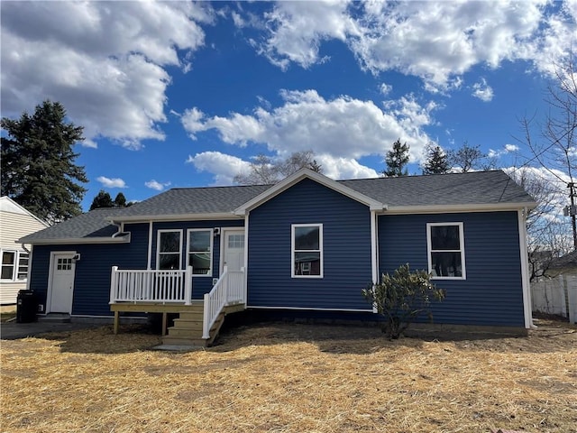 view of front of property with a shingled roof