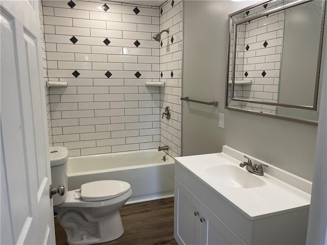 bathroom with bathing tub / shower combination, toilet, vanity, and wood finished floors