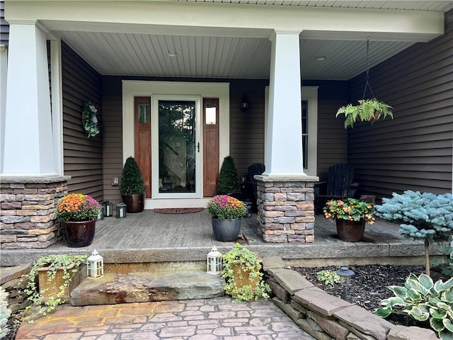 5027 Wyffels Rd, Canandaigua-Town, NY 14424 - property entrance featuring covered porch and stone siding