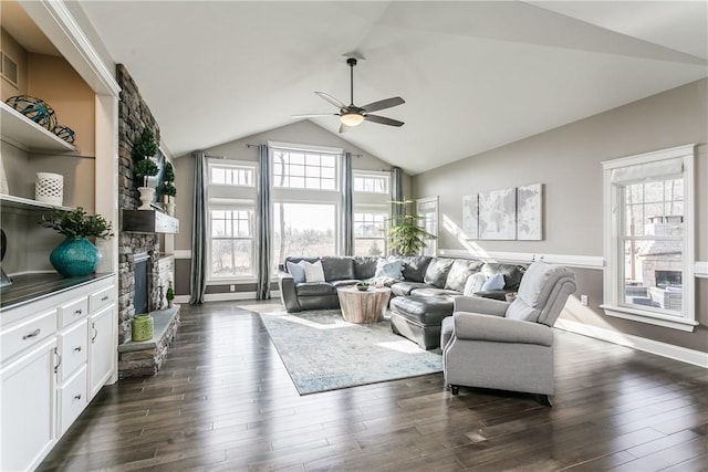 5027 Wyffels Rd, Canandaigua-Town, NY 14424 - living area with ceiling fan, a stone fireplace, vaulted ceiling, baseboards, and dark wood-type flooring