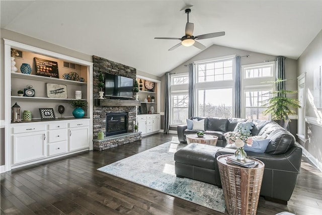 5027 Wyffels Rd, Canandaigua-Town, NY 14424 - living area featuring vaulted ceiling, plenty of natural light, a fireplace, and a ceiling fan