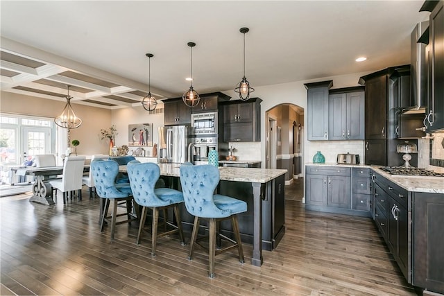 5027 Wyffels Rd, Canandaigua-Town, NY 14424 - kitchen with a breakfast bar area, appliances with stainless steel finishes, arched walkways, dark wood-style floors, and coffered ceiling