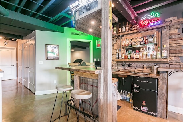 5027 Wyffels Rd, Canandaigua-Town, NY 14424 - bar featuring concrete flooring, baseboards, recessed lighting, and a dry bar