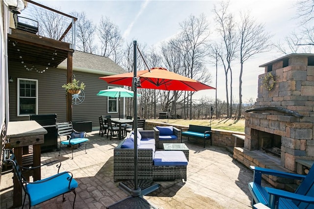5027 Wyffels Rd, Canandaigua-Town, NY 14424 - view of patio / terrace with outdoor dining area and an outdoor living space with a fireplace