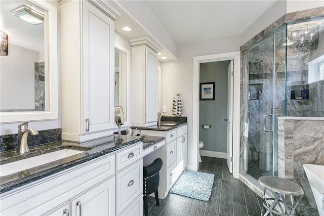 5027 Wyffels Rd, Canandaigua-Town, NY 14424 - bathroom featuring double vanity, a sink, toilet, and a shower stall