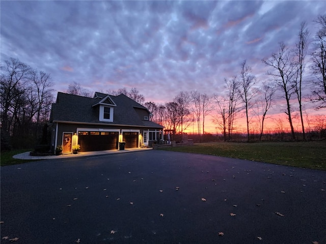 5027 Wyffels Rd, Canandaigua-Town, NY 14424 - view of front facade featuring an attached garage and aphalt driveway