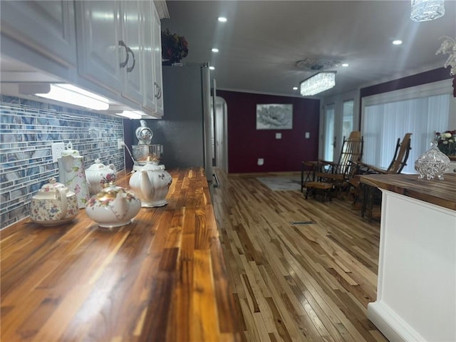 612 Oswegatchie Rd, Palatine, NY 13428 - kitchen with butcher block counters, wood finished floors, and recessed lighting