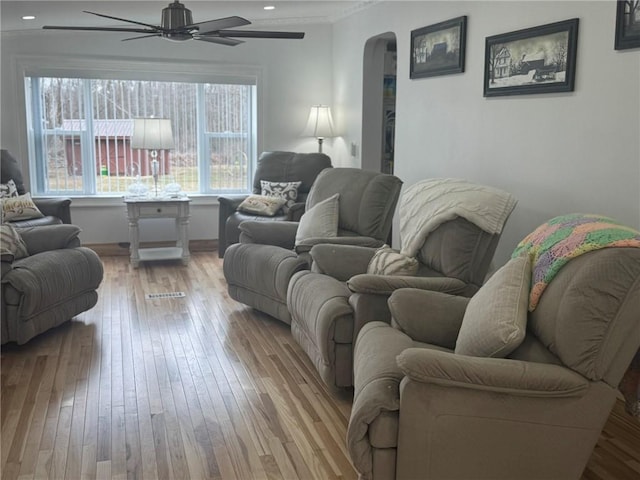 612 Oswegatchie Rd, Palatine, NY 13428 - living room with hardwood / wood-style floors, arched walkways, a ceiling fan, recessed lighting, and baseboards