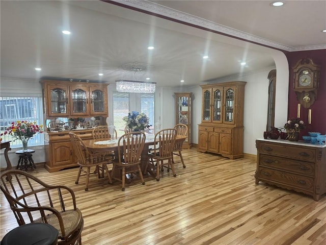 612 Oswegatchie Rd, Palatine, NY 13428 - dining area featuring light wood-type flooring, ornamental molding, recessed lighting, arched walkways, and baseboards