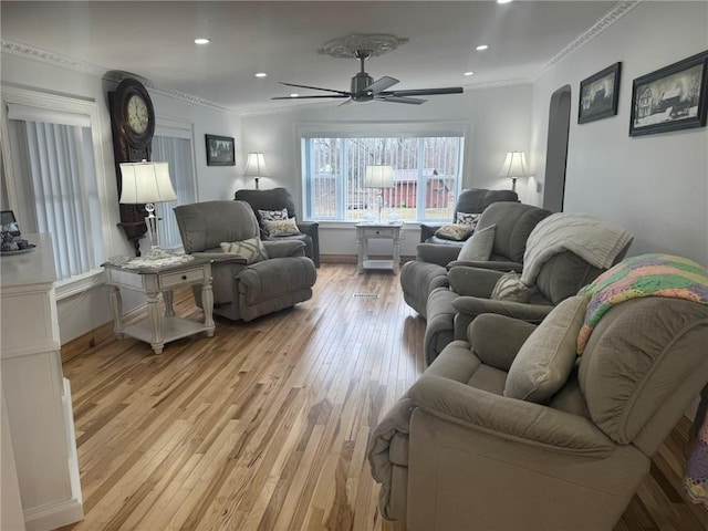 612 Oswegatchie Rd, Palatine, NY 13428 - living room with ceiling fan, light wood-style floors, crown molding, arched walkways, and recessed lighting