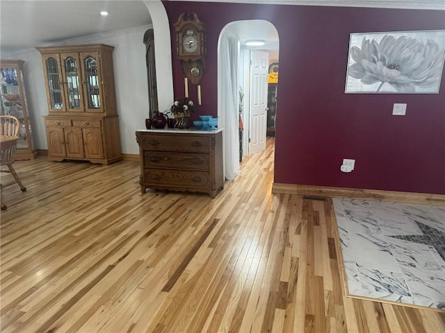 612 Oswegatchie Rd, Palatine, NY 13428 - interior space with light wood-type flooring, arched walkways, ornamental molding, and baseboards